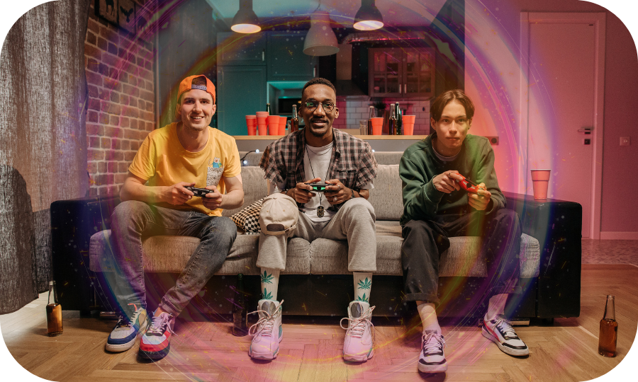 3 males gaming on counch